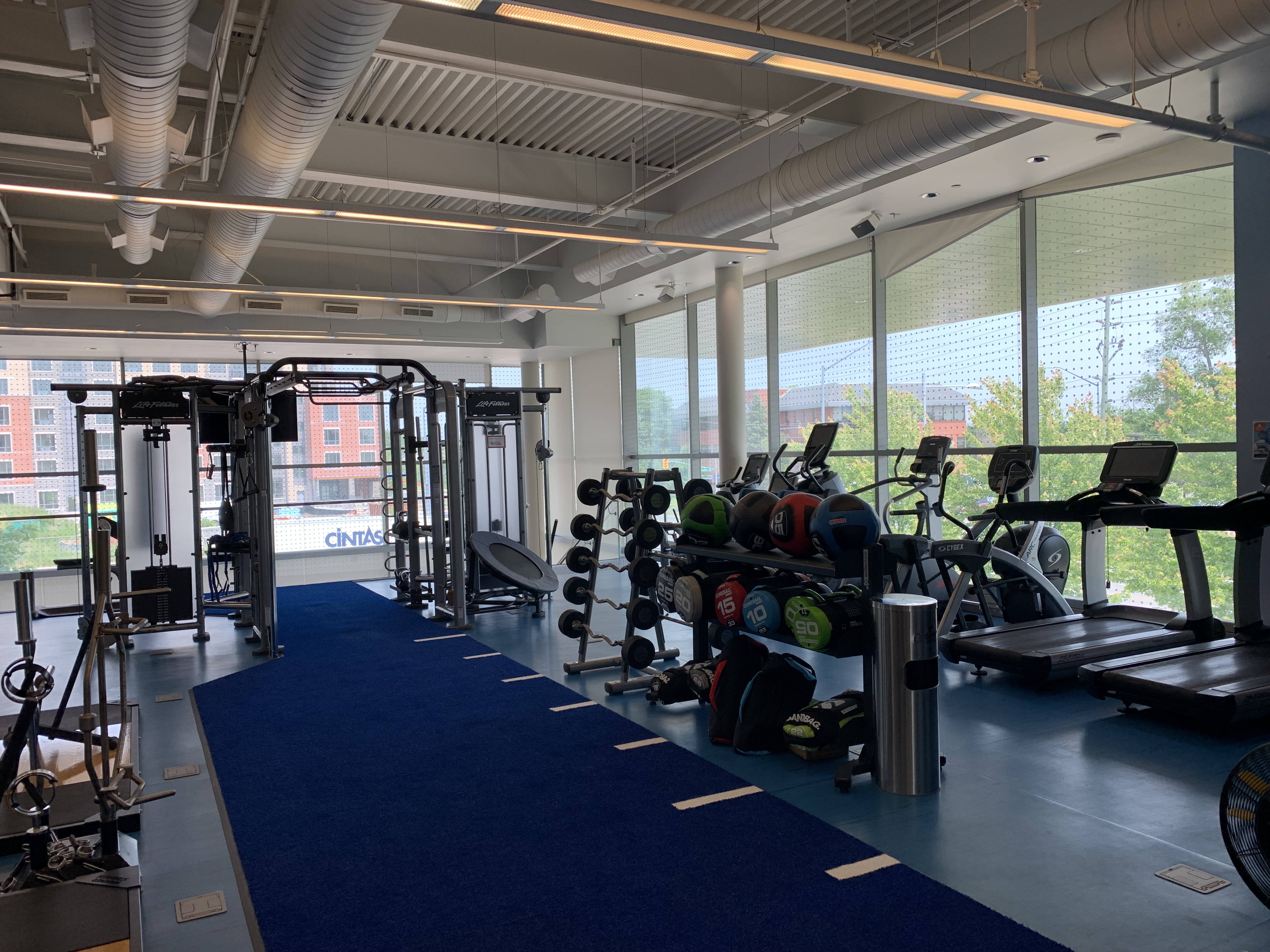 Interior of gym surrounded by windows.