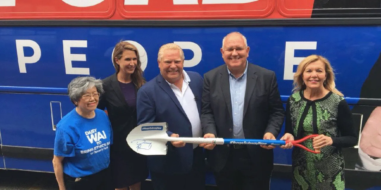 Doug Ford and Frank Scrapitti holding a shovel.