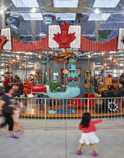 People playing on the Pride of Canada Carousel.