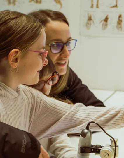 Family interacting with indoor exhibit.