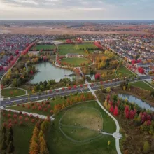 Overhead view of a neighbourhood and pond
