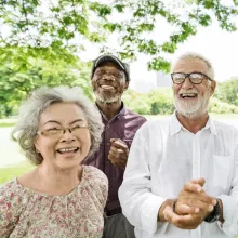 Seniors smiling outdoors.