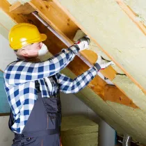Person installing insulation 