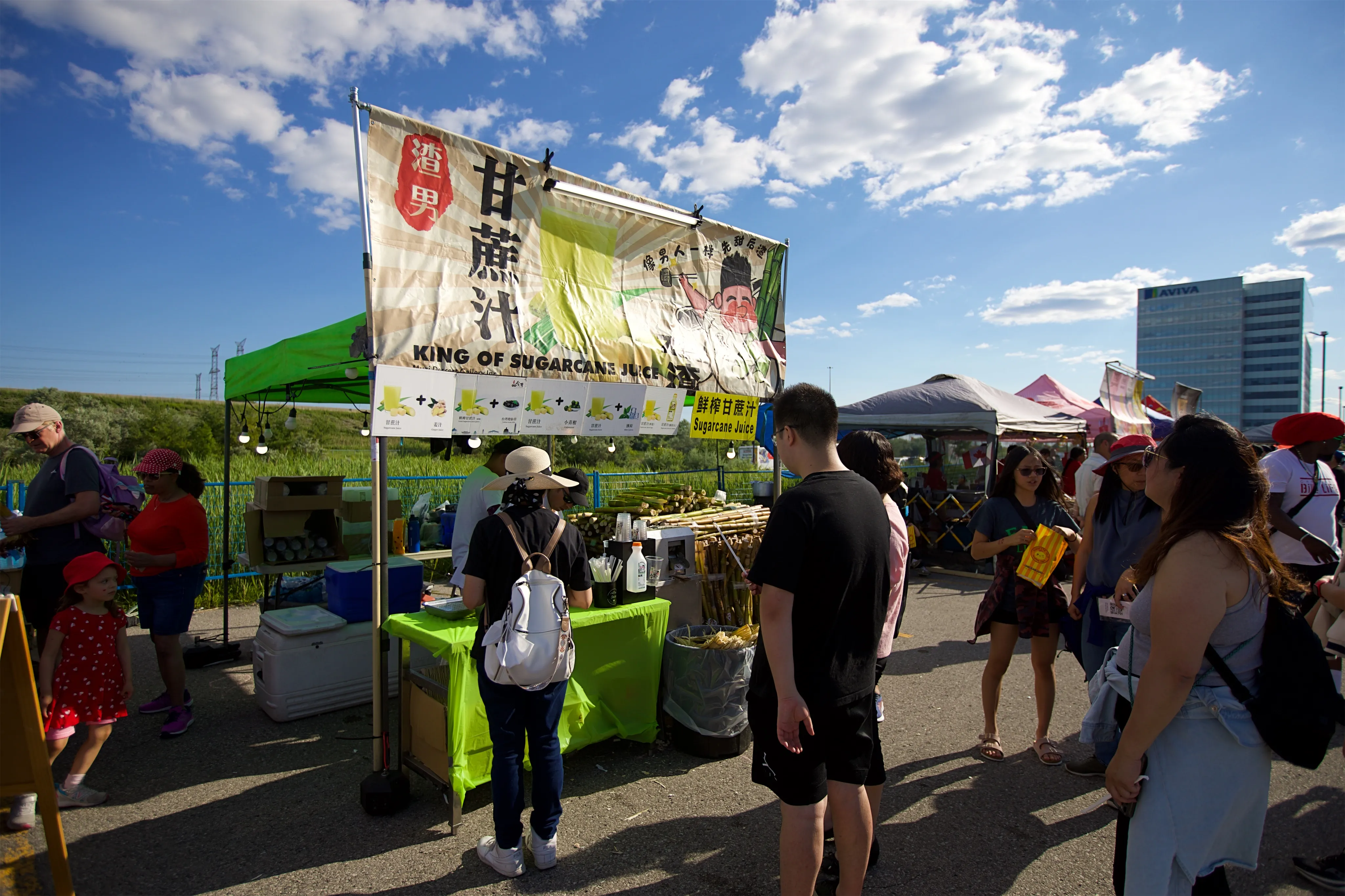 People in line at food stand.