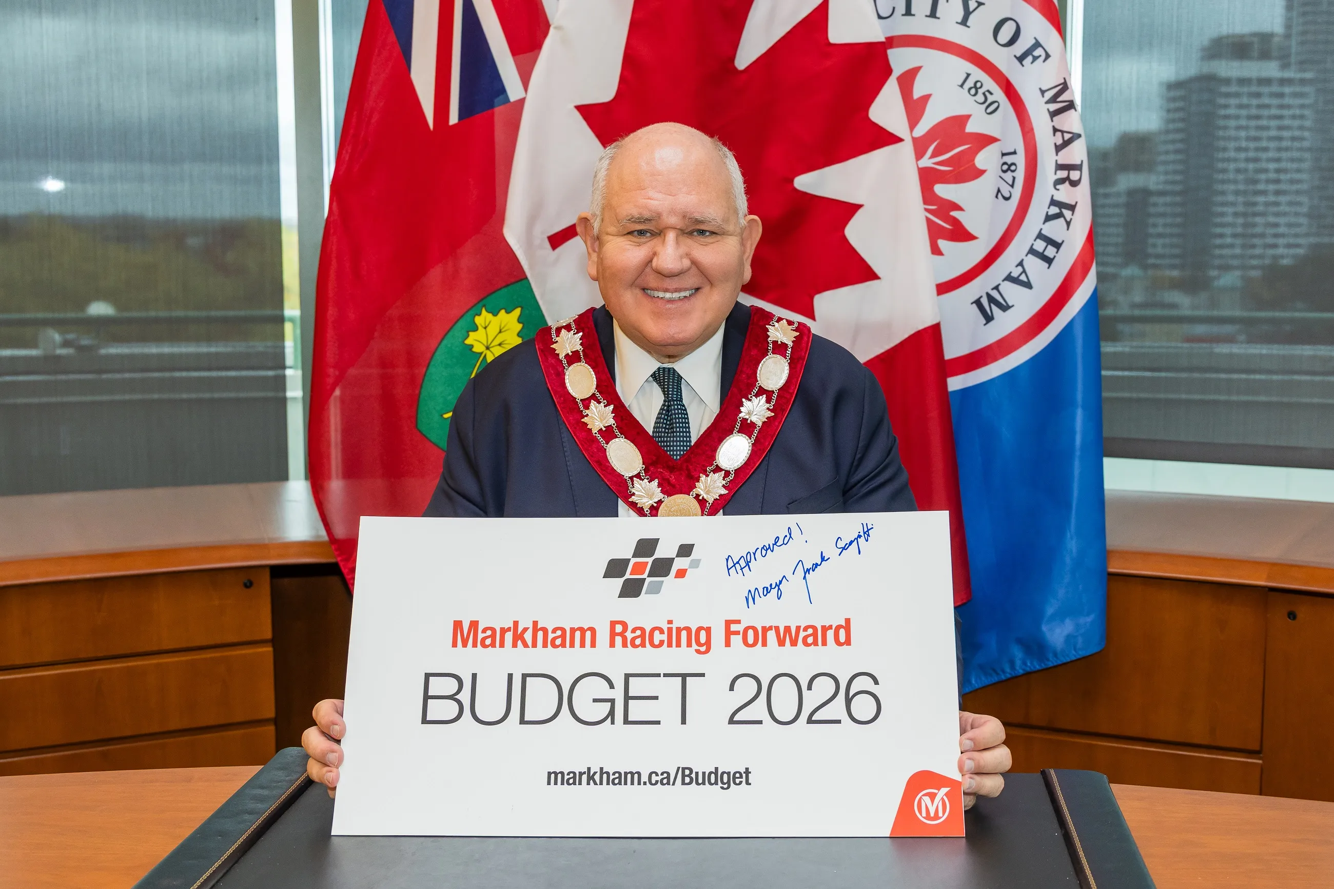Mayor Frank Scarpitti displays a signed Budget 2026 sign at the Markham Civic Centre on Oct. 31, 2025.
