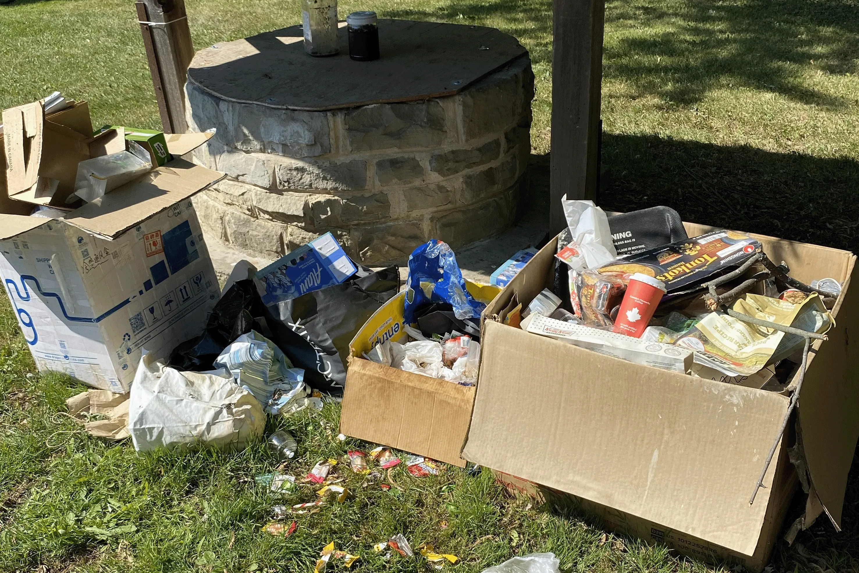 Trash littering a public park.